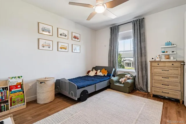 a bed room with a bed and a window