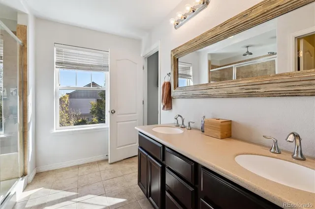 a view of a white house with table and chairs