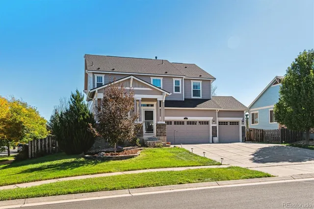 a view of a patio with table and chairs with wooden fence and plants
