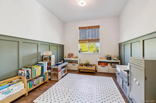 a bed room with a bed and a book shelf