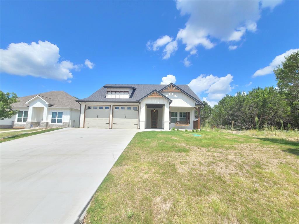 4825 Wichita Street Granbury, TX 76048 - Photo 3 of 30 a front view of a house with a yard