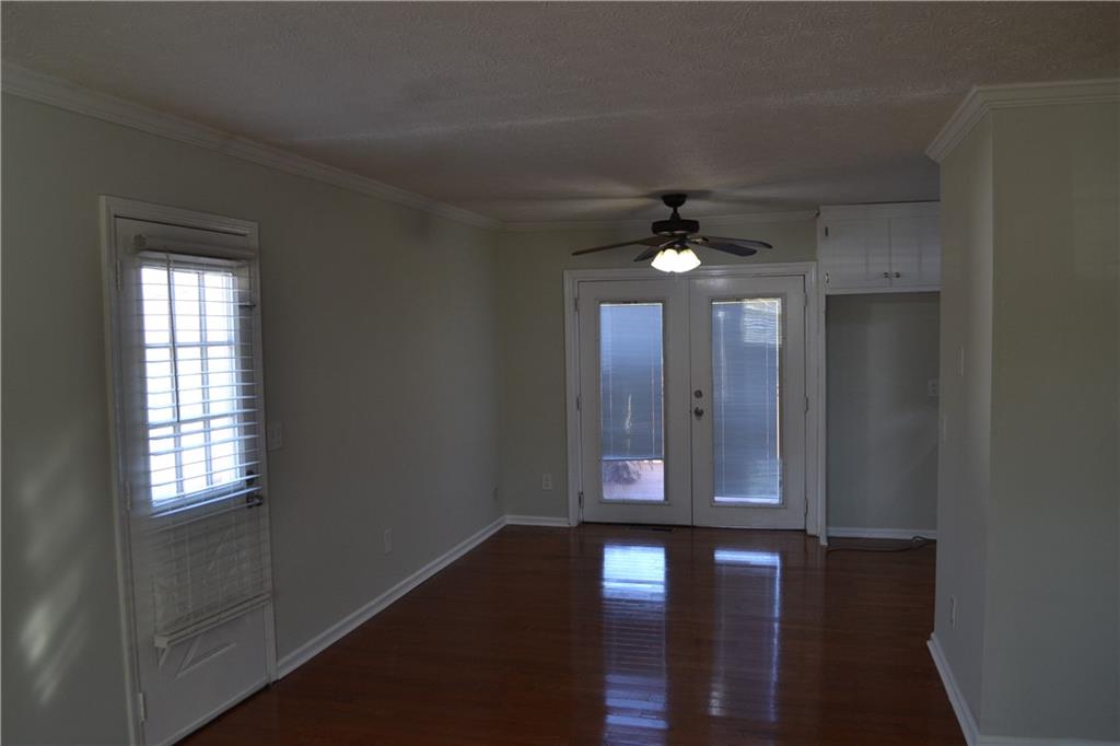 555 Lee Byrd Road Loganville, GA 30052 - Photo 14 of 23 a view of a hallway with windows and chandelier