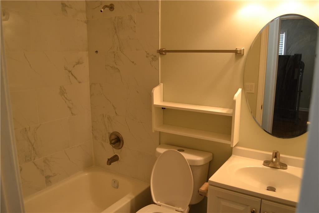 555 Lee Byrd Road Loganville, GA 30052 - Photo 17 of 23 a bathroom with a sink toilet and shower