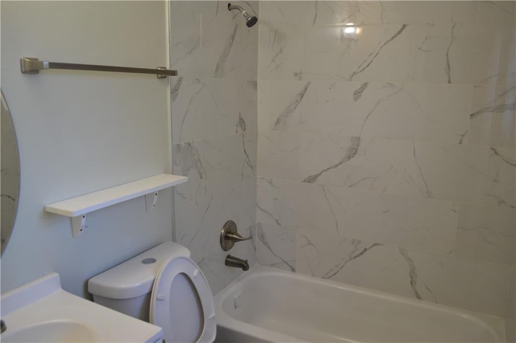 555 Lee Byrd Road Loganville, GA 30052 - Photo 18 of 23 a bathroom with a sink and toilet