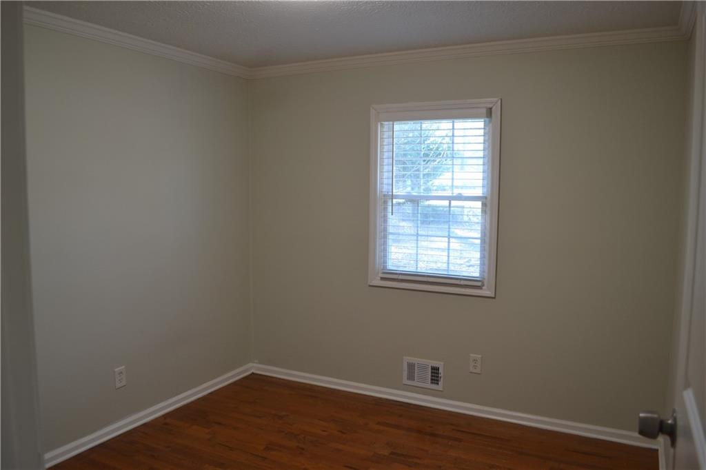 555 Lee Byrd Road Loganville, GA 30052 - Photo 22 of 23 a view of a small space with wooden floor and a window