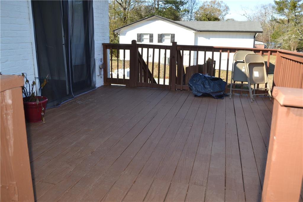 555 Lee Byrd Road Loganville, GA 30052 - Photo 5 of 23 a view of a chairs and table on the wooden floor
