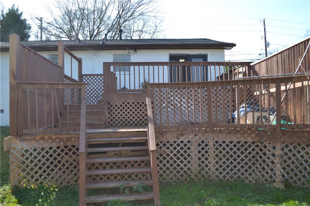 555 Lee Byrd Road Loganville, GA 30052 - Photo 8 of 23 a view of a wooden house and a yard