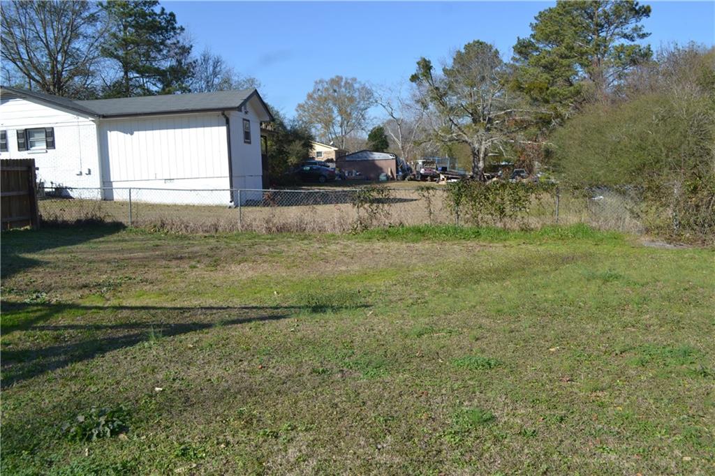 555 Lee Byrd Road Loganville, GA 30052 - Photo 9 of 23 a view of a house with a yard