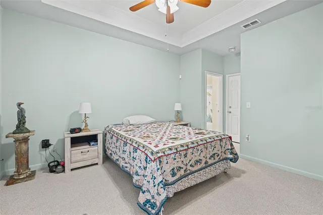 a bedroom with a bed and a cabinets