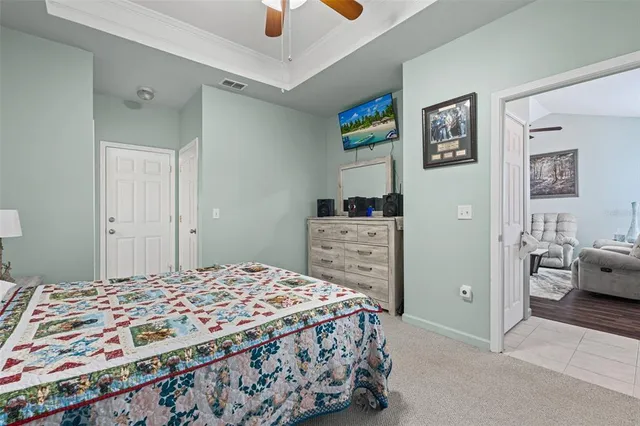 a bedroom with a bed and a dresser in it