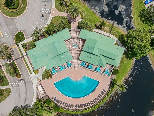 an aerial view of pool patio and outdoor seating