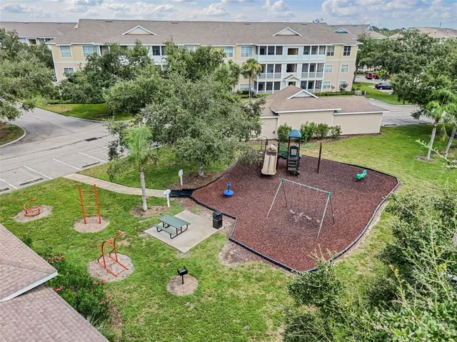 an aerial view of a house with outdoor space
