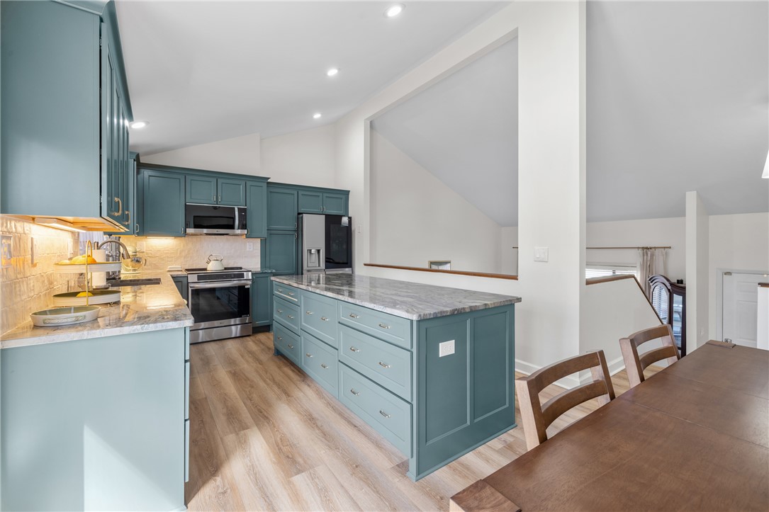 111 Shorecrest Drive Seneca, SC 29672 - Photo 11 of 35 This bright kitchen features ample counter space and a spacious island, perfect for culinary endeavors.