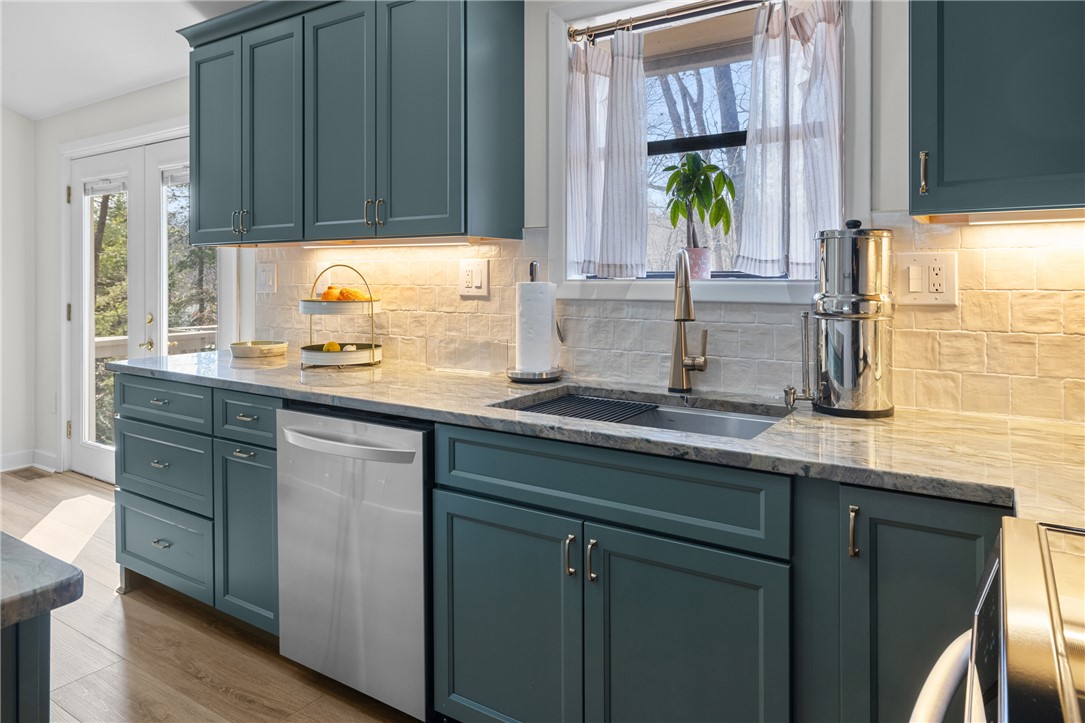 111 Shorecrest Drive Seneca, SC 29672 - Photo 14 of 35 This modern kitchen features elegant countertops and sleek cabinetry, perfect for culinary enthusiasts.