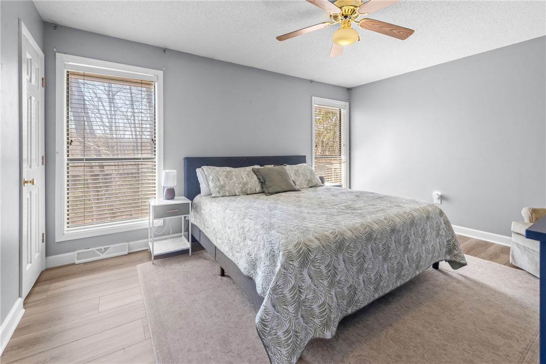 111 Shorecrest Drive Seneca, SC 29672 - Photo 15 of 35 This spacious sleeping area offers comfort and ample natural light through well-placed windows.