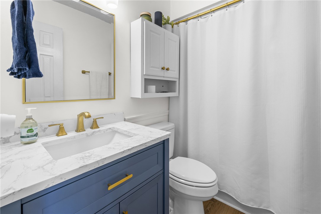 111 Shorecrest Drive Seneca, SC 29672 - Photo 17 of 35 This clean and bright bathroom features a vanity with a white marble countertop.