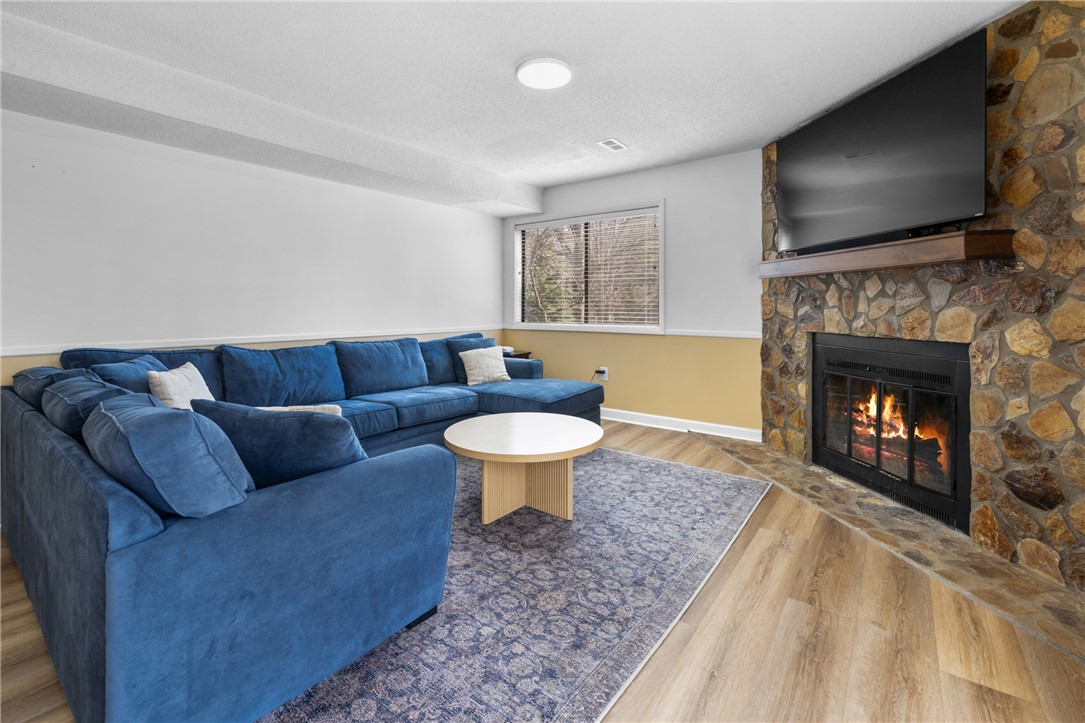 111 Shorecrest Drive Seneca, SC 29672 - Photo 23 of 35 This inviting living space features a cozy fireplace and abundant natural light.