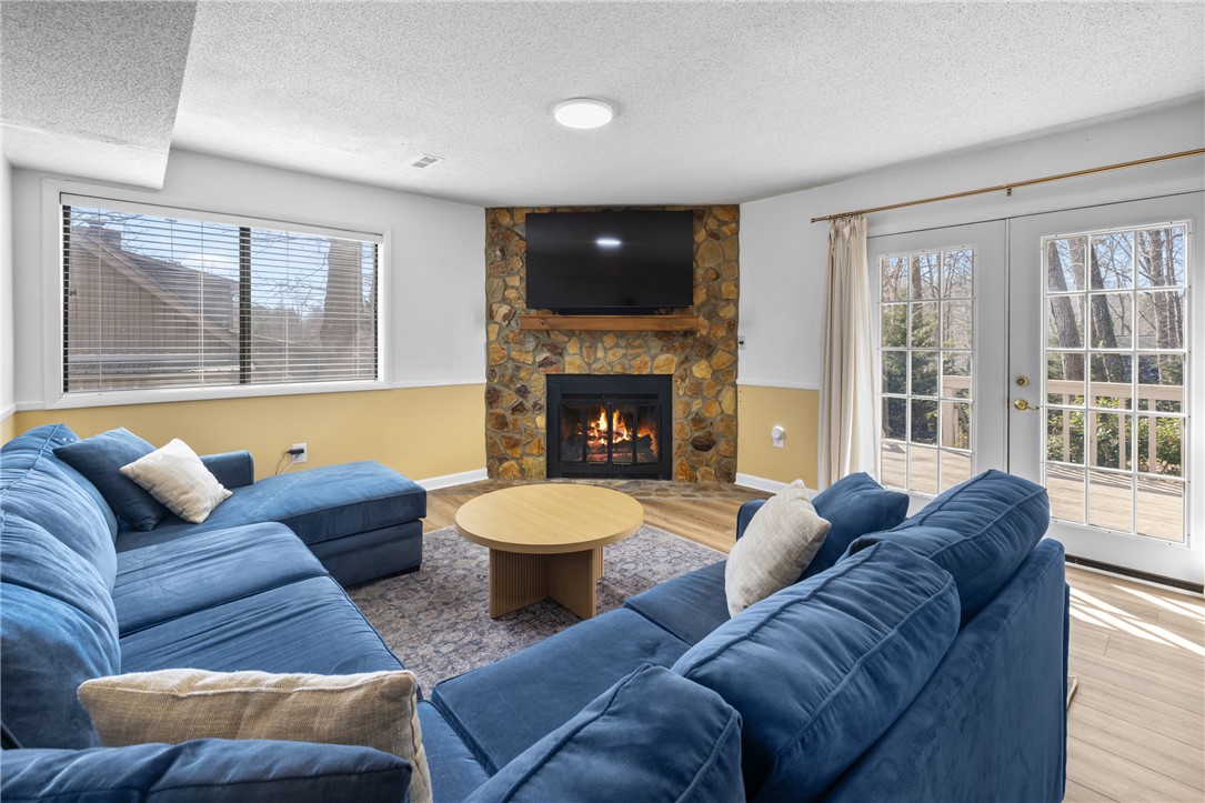 111 Shorecrest Drive Seneca, SC 29672 - Photo 24 of 35 This inviting living space features a cozy fireplace, creating an ideal spot for relaxation and gathering.
