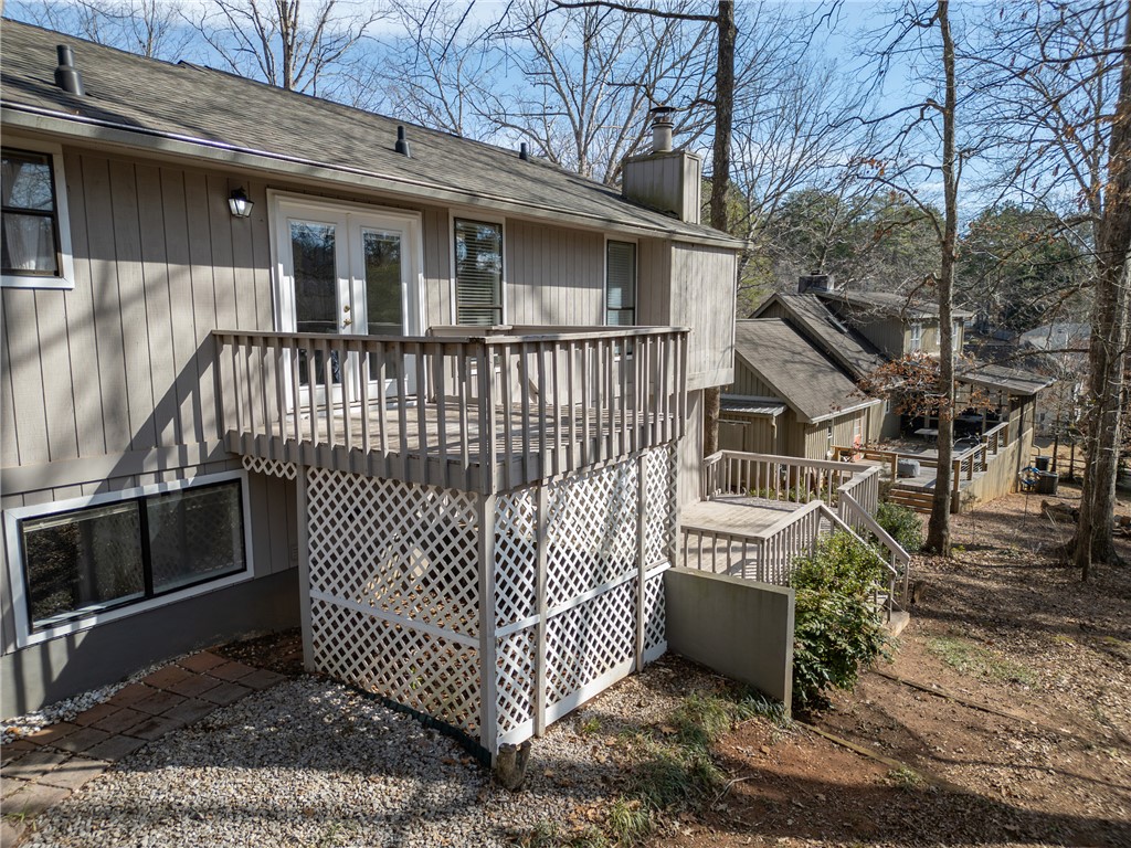 111 Shorecrest Drive Seneca, SC 29672 - Photo 30 of 35 An inviting rear deck provides a private outdoor retreat, perfect for relaxation and enjoying the natural surroundings.