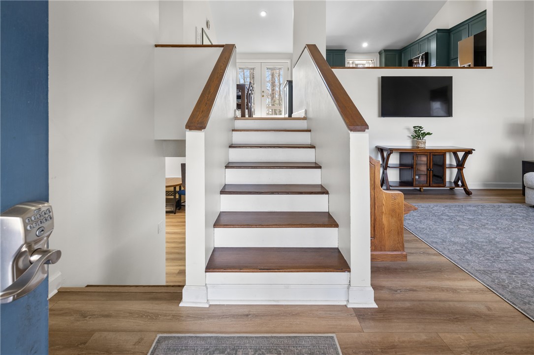 111 Shorecrest Drive Seneca, SC 29672 - Photo 4 of 35 This inviting interior features a central staircase and elegant hardwood flooring.