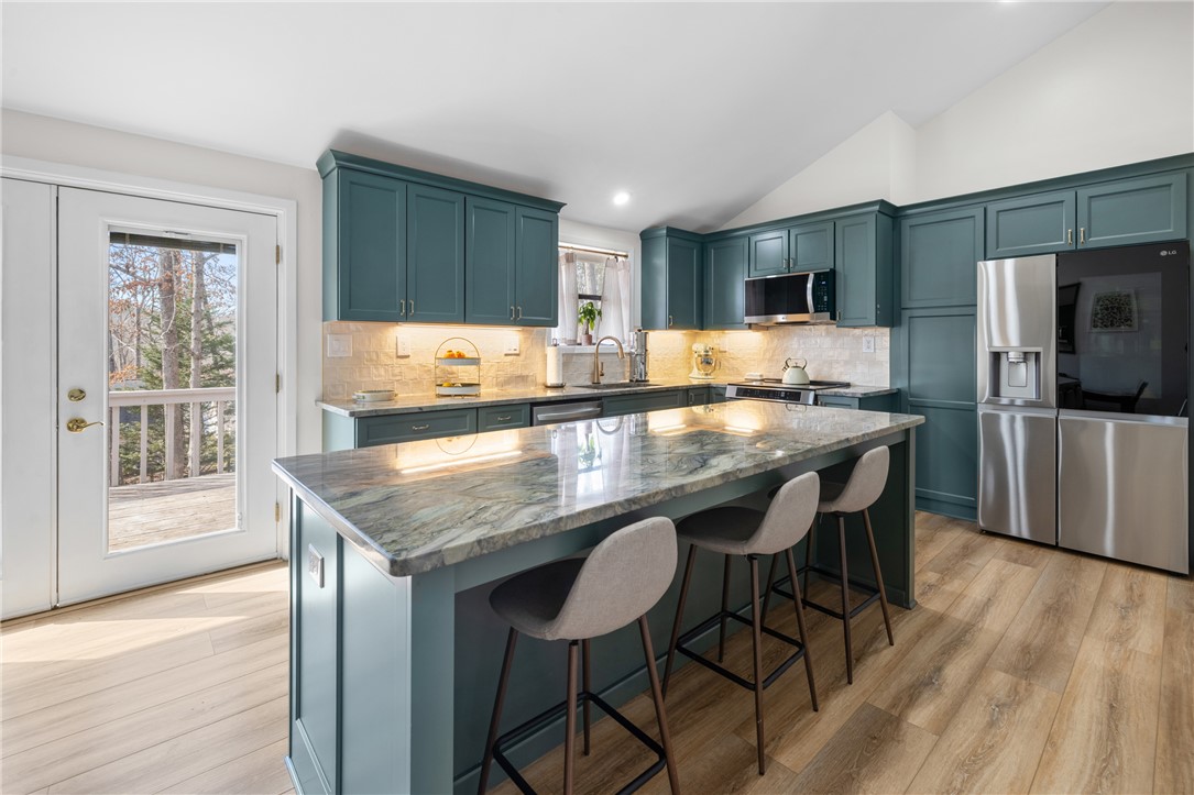 111 Shorecrest Drive Seneca, SC 29672 - Photo 9 of 35 This kitchen features a beautiful kitchen island, providing a central hub for cooking and entertaining.