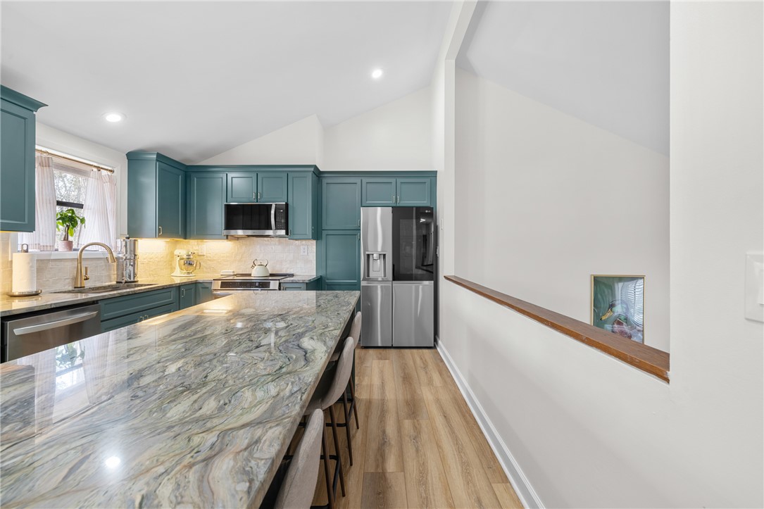 111 Shorecrest Drive Seneca, SC 29672 - Photo 10 of 35 This modern kitchen features a spacious island and contemporary finishes, perfect for entertaining.