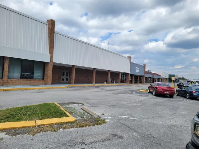 a view of a car is parked in front of a building