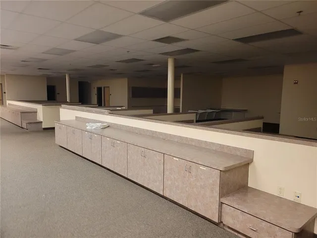 a bathroom with a sink and a large mirror