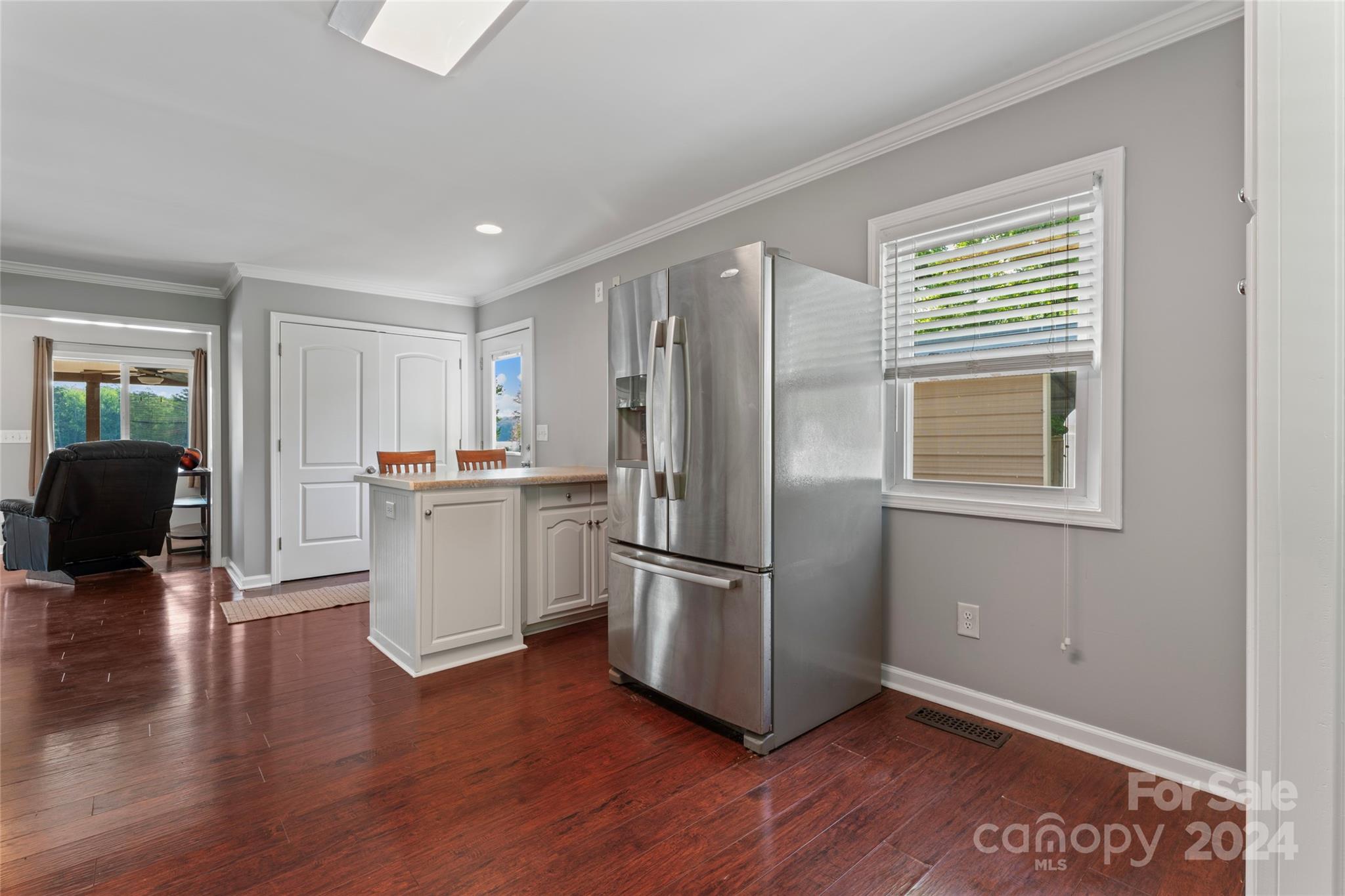 1270 Pole Branch Road Clover, SC 29710 - Photo 13 of 41 a kitchen with stainless steel appliances granite countertop a refrigerator microwave and wooden floor