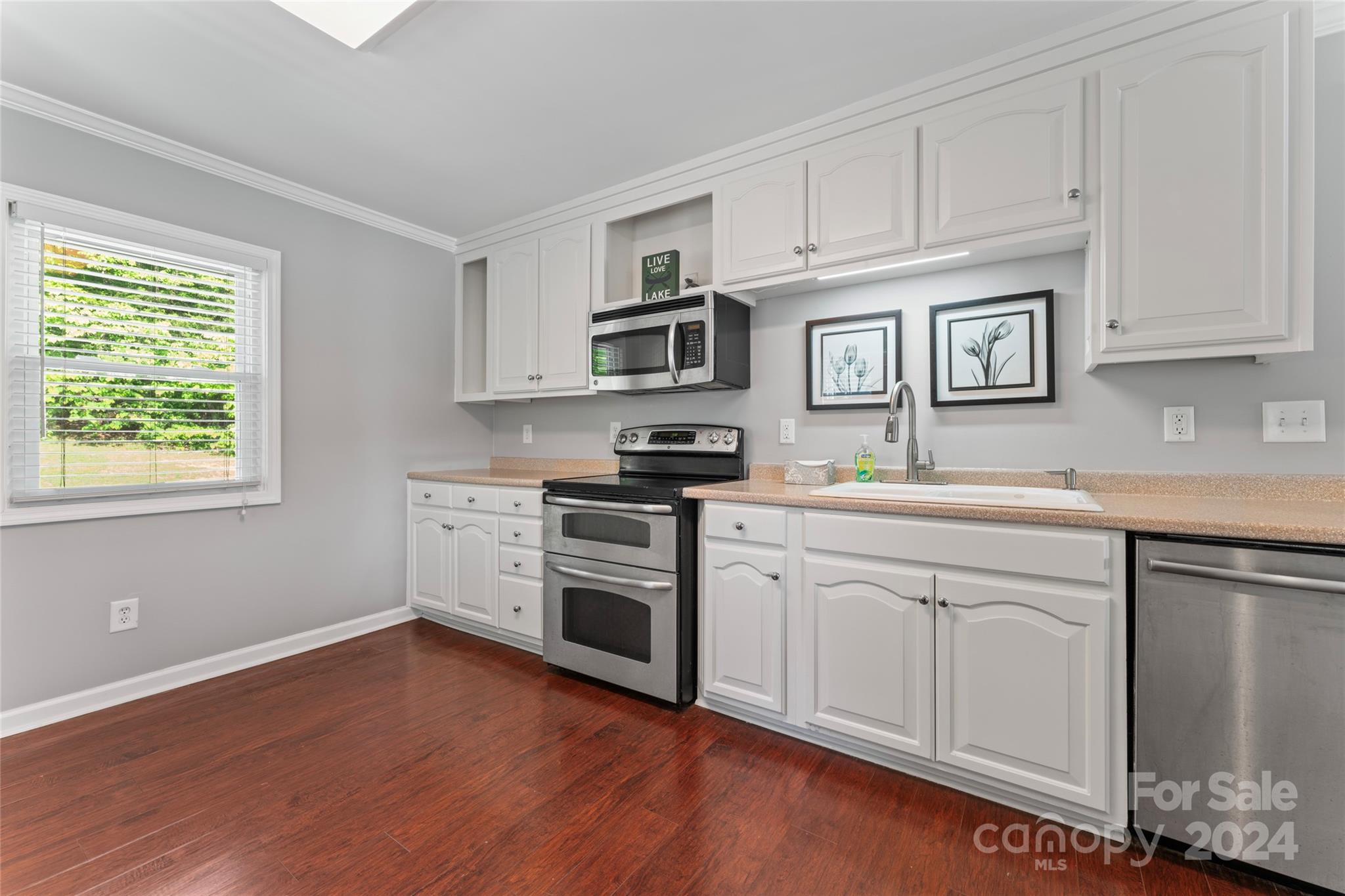 1270 Pole Branch Road Clover, SC 29710 - Photo 14 of 41 a kitchen with stainless steel appliances granite countertop a stove a sink and a microwave