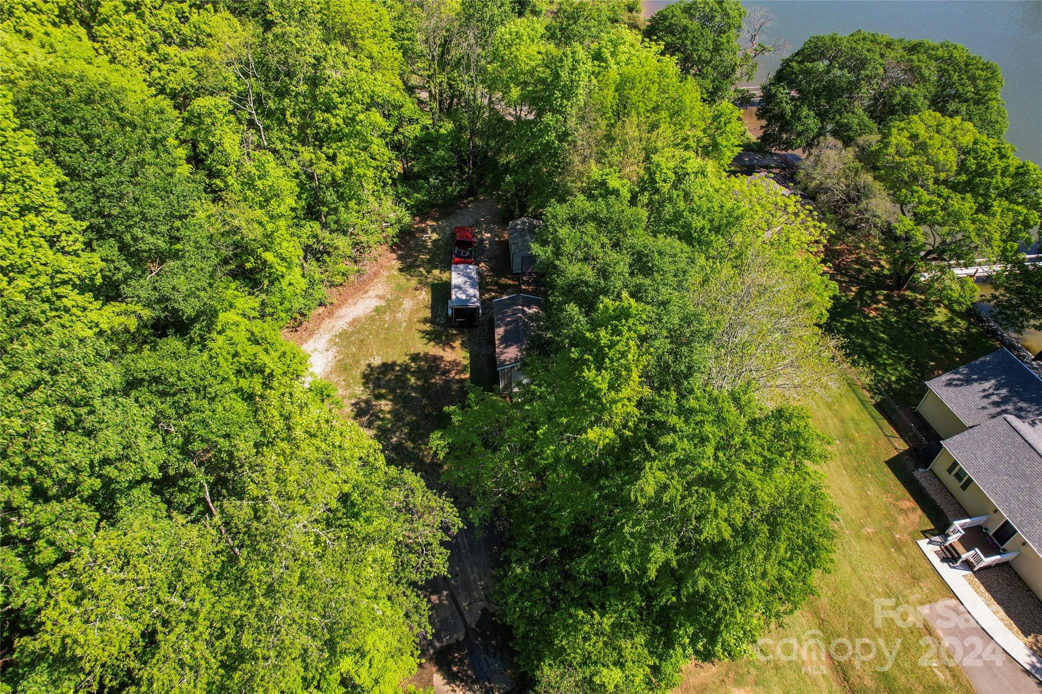 1270 Pole Branch Road Clover, SC 29710 - Photo 30 of 41 a backyard of a house with lots of green space and trees all around