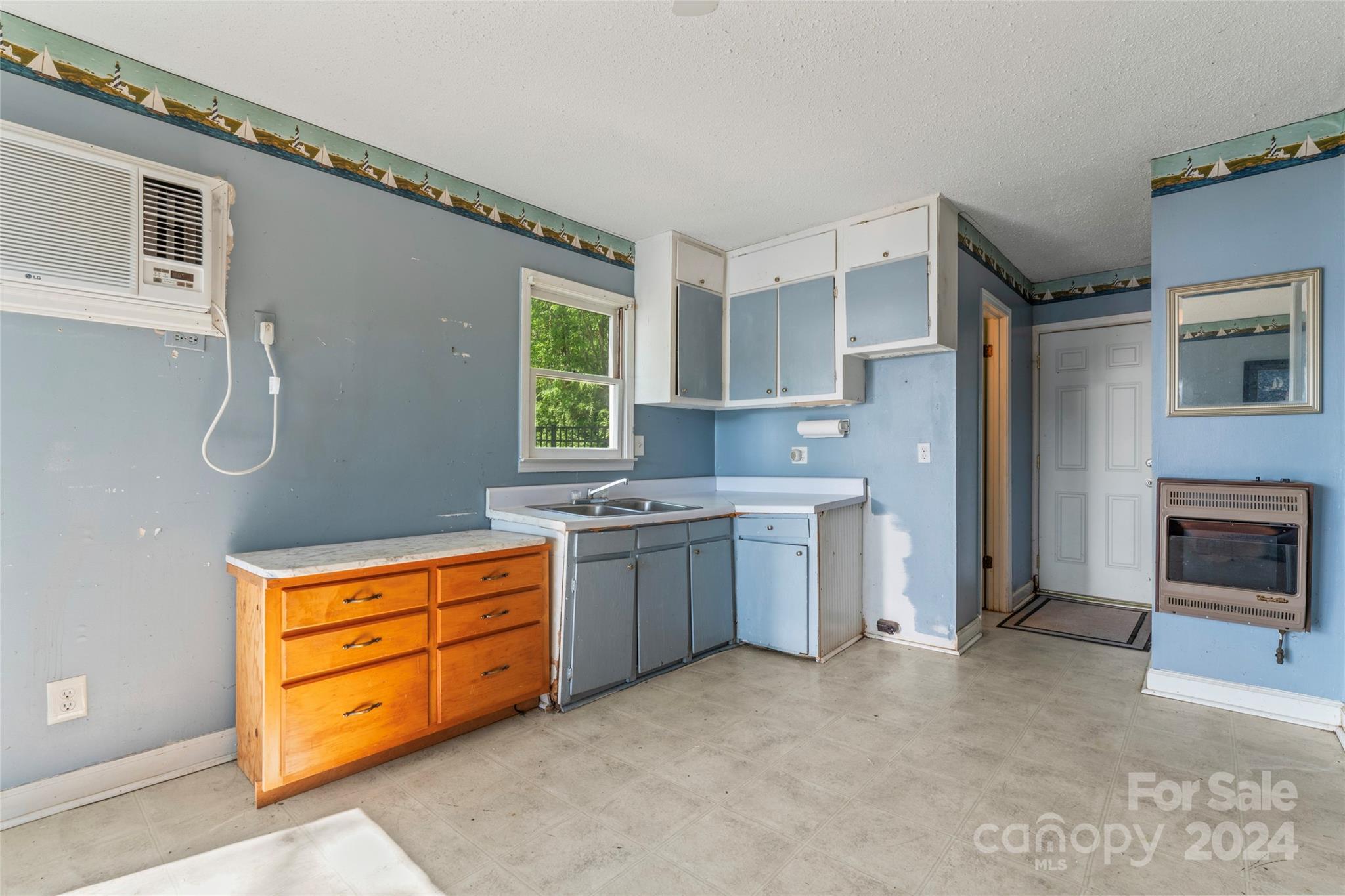 1270 Pole Branch Road Clover, SC 29710 - Photo 38 of 41 a kitchen with stainless steel appliances granite countertop a stove and a refrigerator