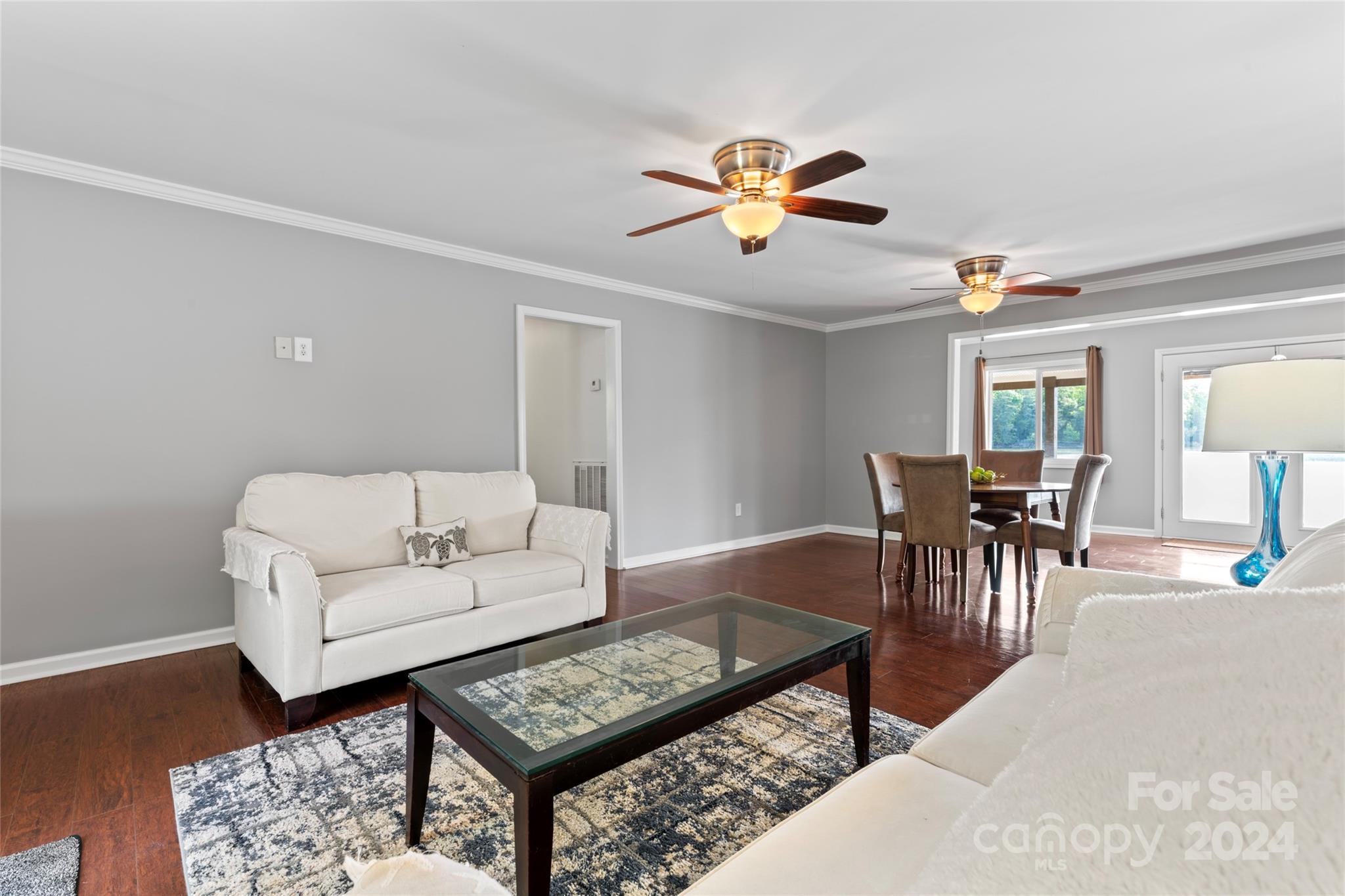 1270 Pole Branch Road Clover, SC 29710 - Photo 7 of 41 a living room with furniture a dining table and a chandelier