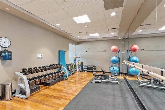a gym room with lots of gym equipment