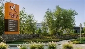 a view of a street with sitting area