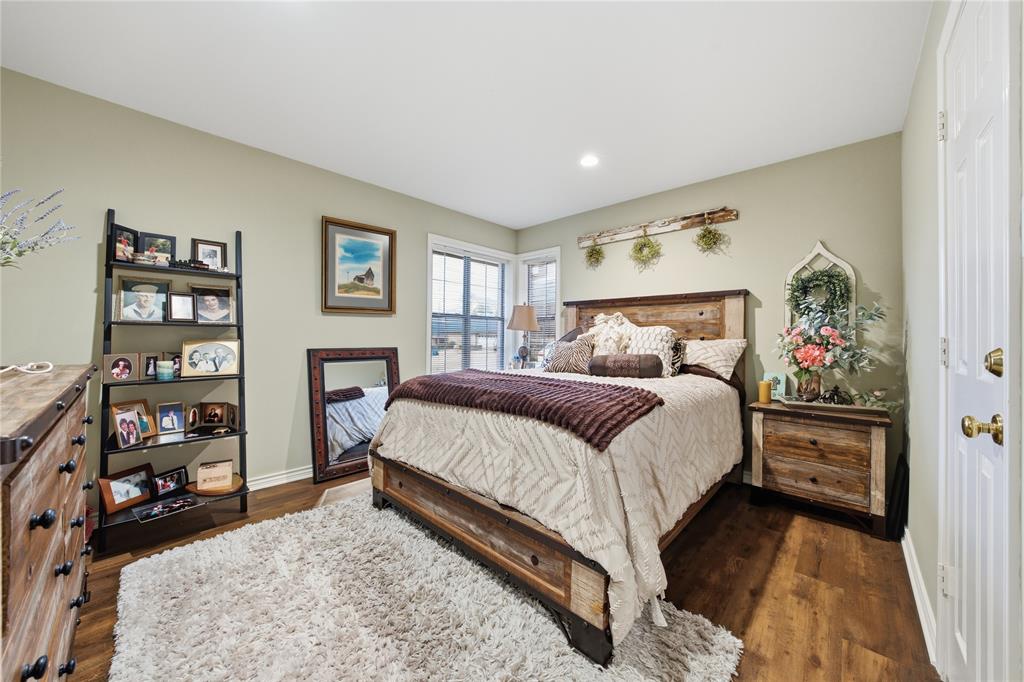 820 Toribrooke Athens, TX 75751 - Photo 14 of 23 a bedroom with a bed and a book shelf