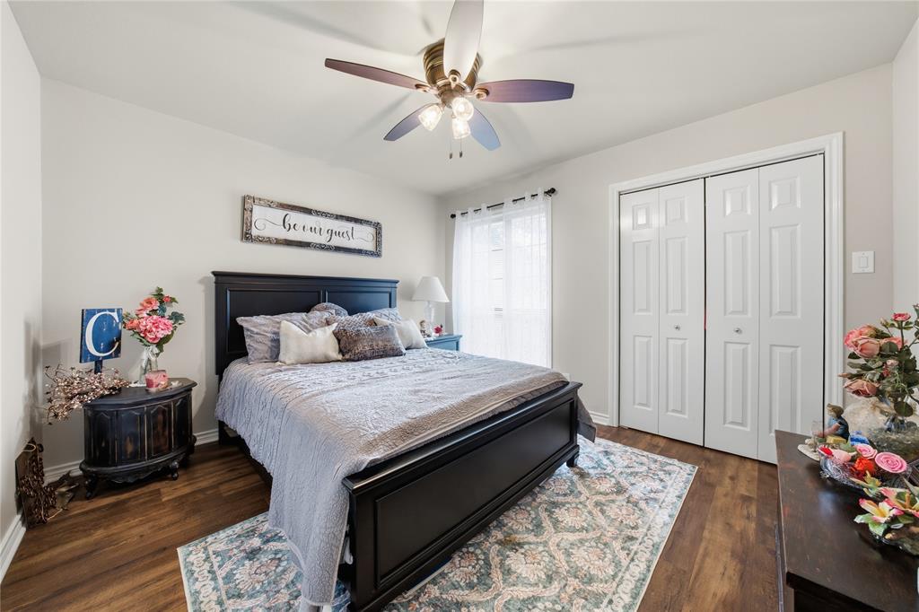 820 Toribrooke Athens, TX 75751 - Photo 16 of 23 a bed room with a bed and a chandelier