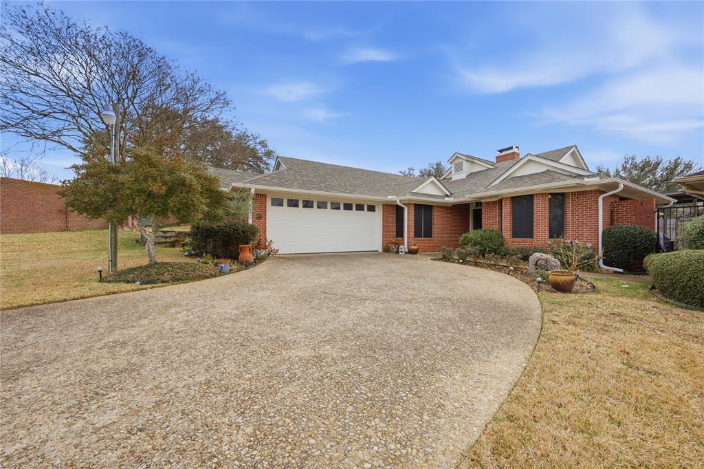 820 Toribrooke Athens, TX 75751 - Photo 22 of 23 a front view of a house with a yard and garage