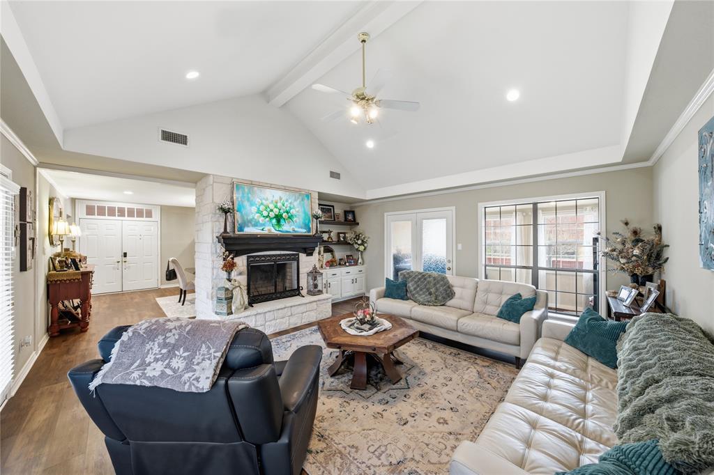 820 Toribrooke Athens, TX 75751 - Photo 3 of 23 a living room with furniture a fireplace and a chandelier