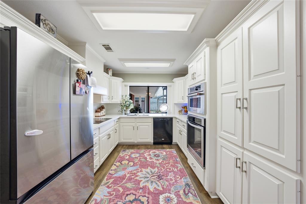 820 Toribrooke Athens, TX 75751 - Photo 9 of 23 a kitchen with stainless steel appliances granite countertop a refrigerator and a sink