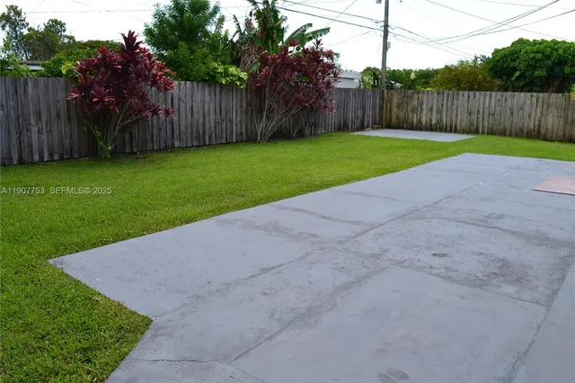 a view of a backyard with green space