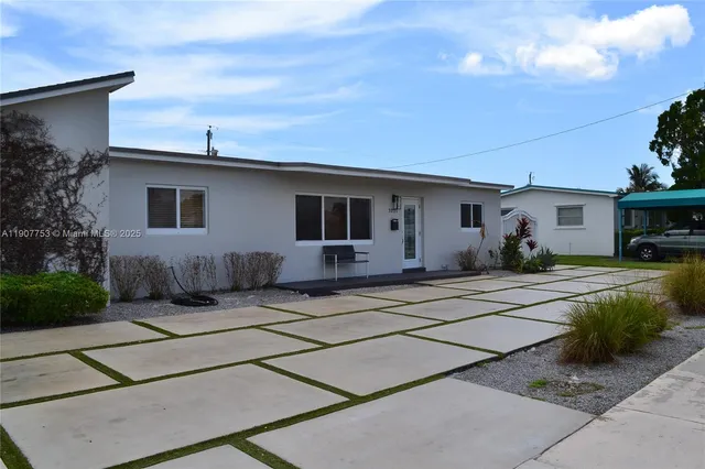 a front view of a house with garage