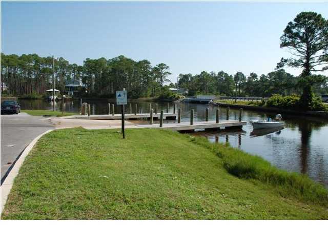 11-12 Indian Woman Road Santa Rosa Beach, FL 32459 - Photo 10 of 12 a backyard of a house with lots of green space