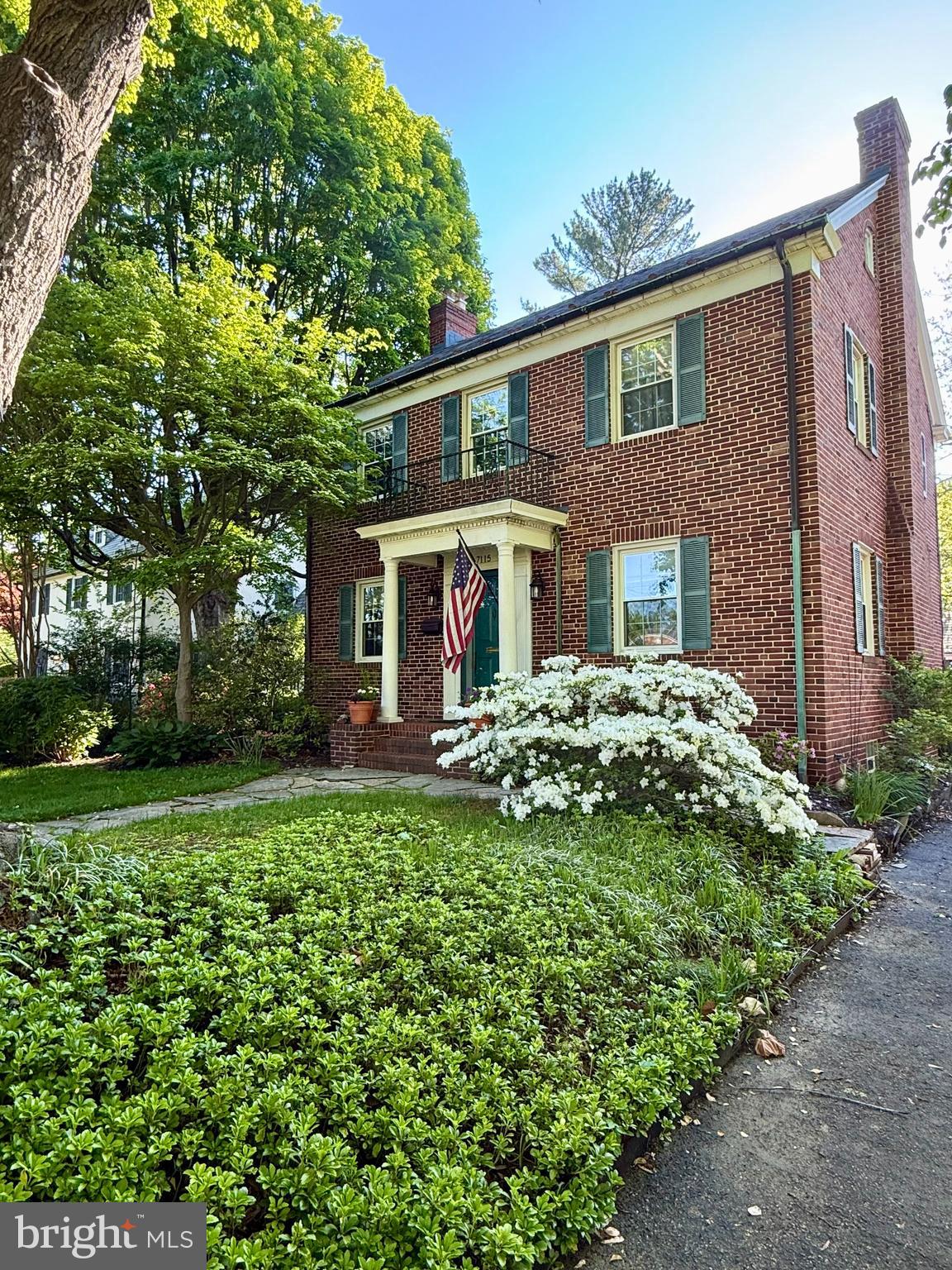 7115 York Road Baltimore, MD 21212 - Photo 1 of 3 a front view of a house with a garden