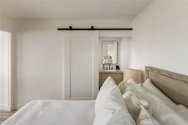 a bathroom with a granite countertop sink toilet a mirror and shower