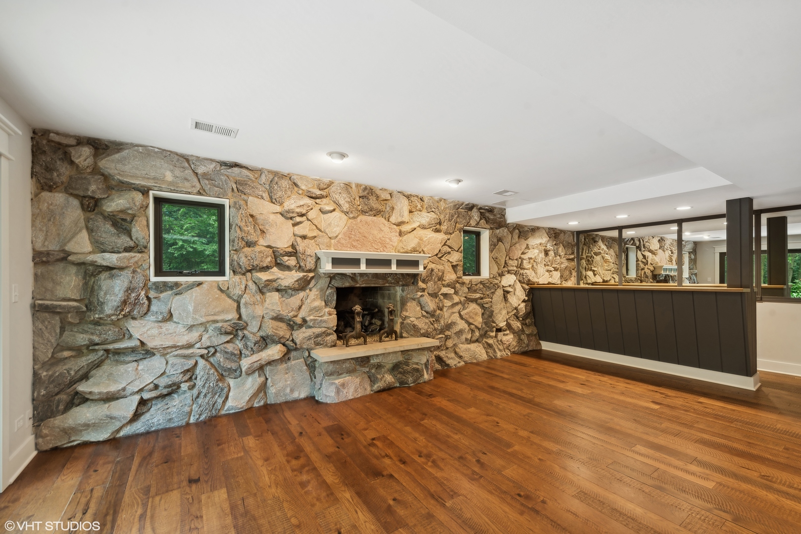 268 Stonegate Road Cary, IL 60013 - Photo 14 of 35 a living room with furniture wooden floor and a fireplace