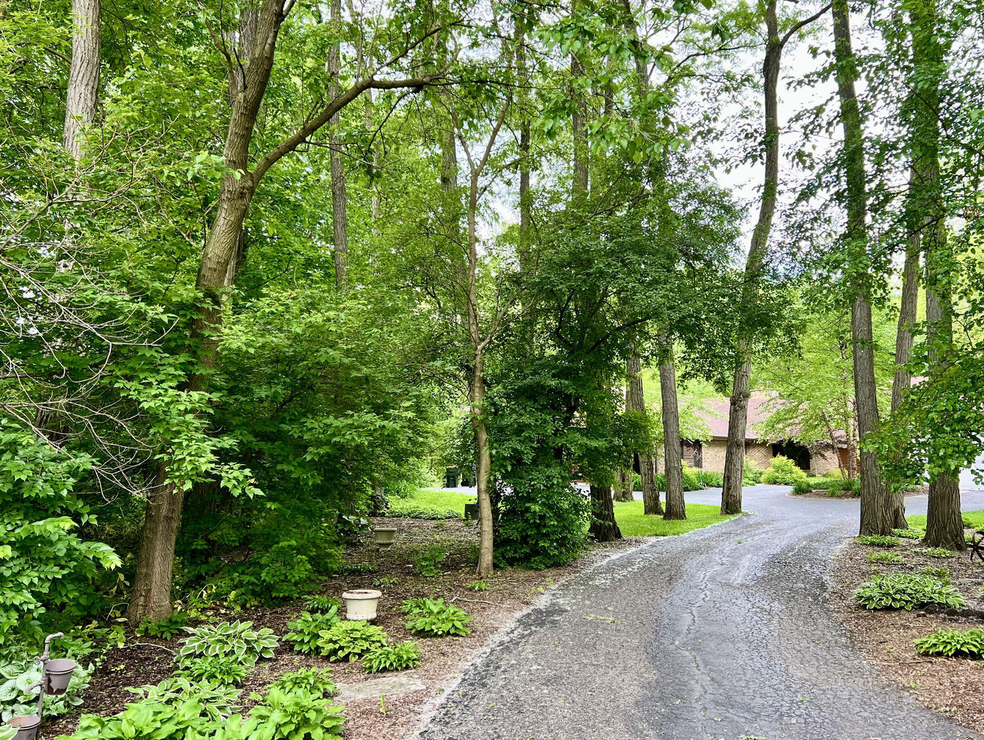 268 Stonegate Road Cary, IL 60013 - Photo 2 of 35 a view of a street with large trees
