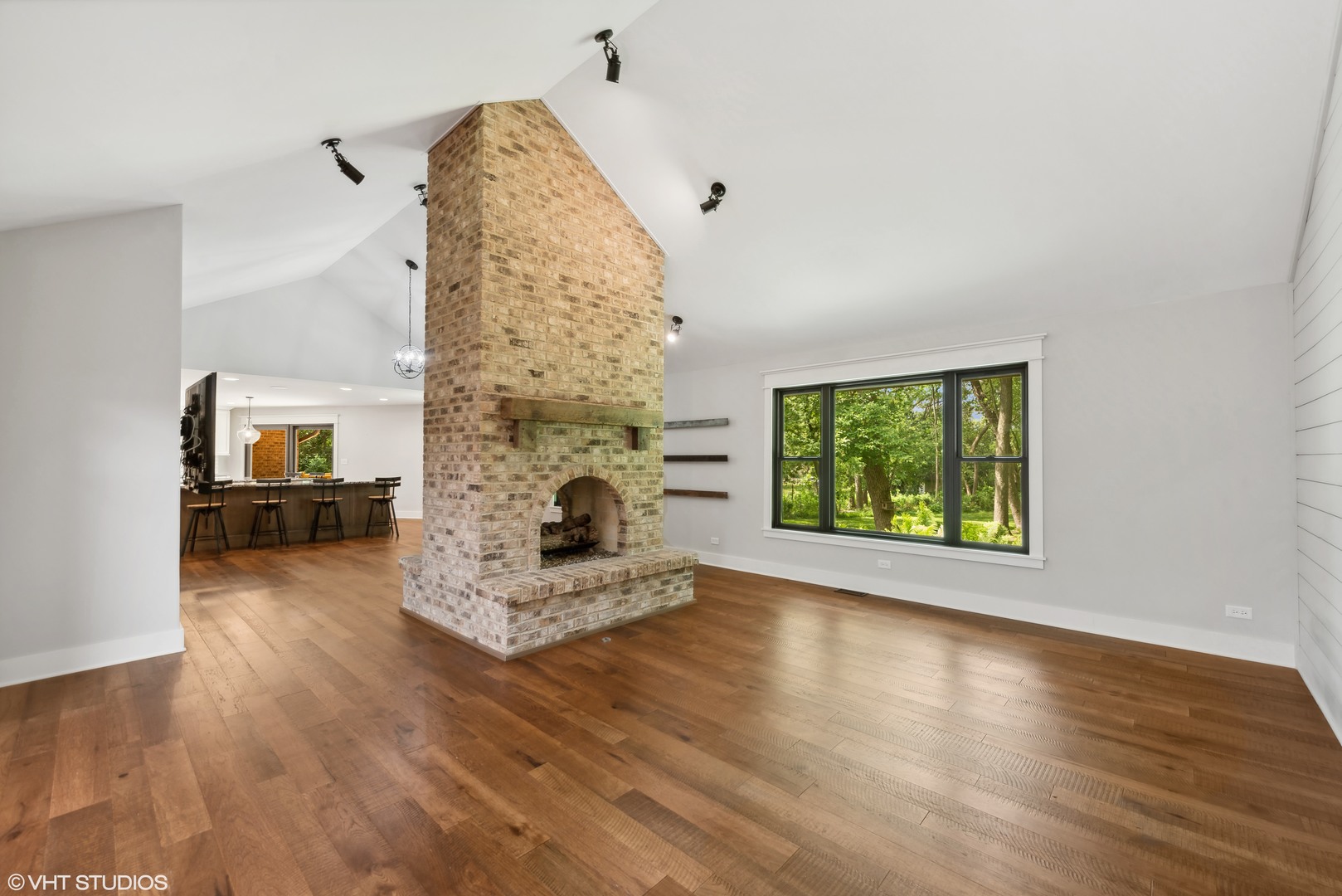 268 Stonegate Road Cary, IL 60013 - Photo 5 of 35 a living room with furniture and a fireplace