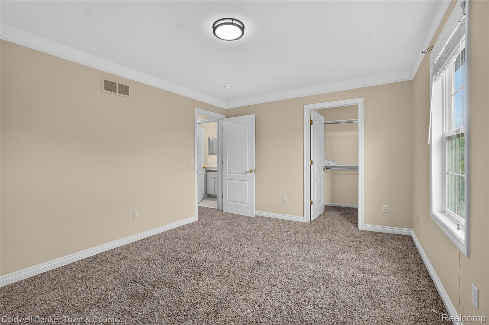 1725 Town Commons Drive Howell, MI 48855 - Photo 39 of 53 Carpeted room with neutral wall paint and white trim