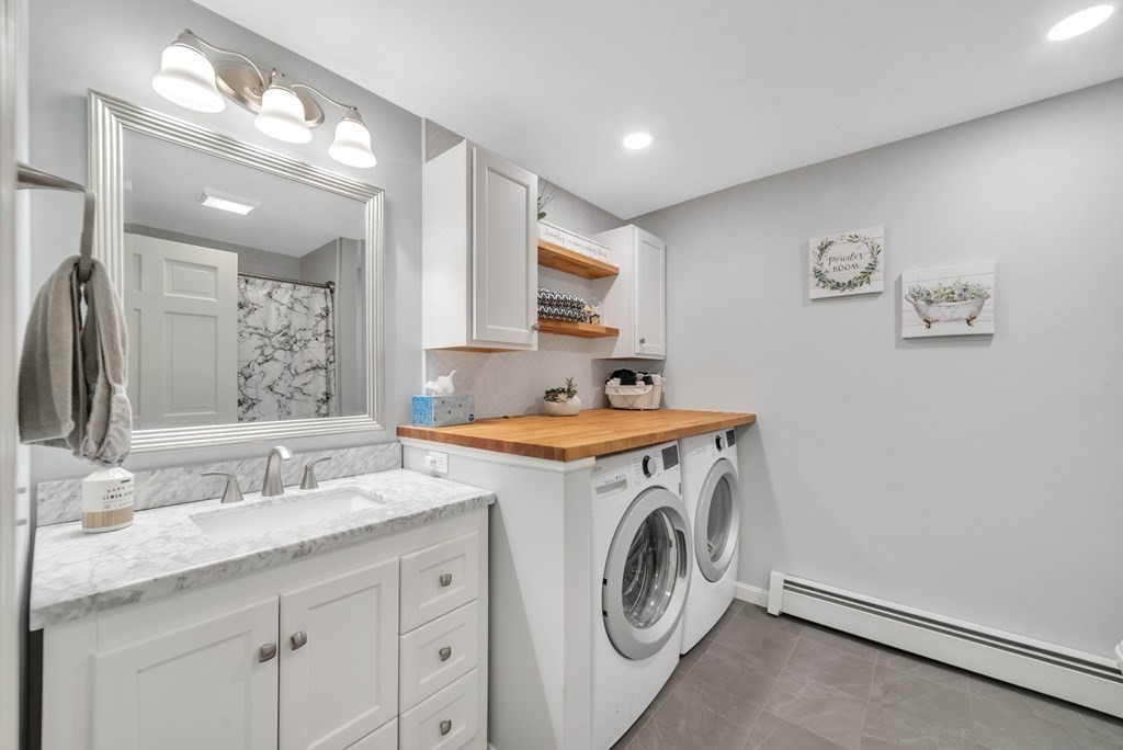 4 Stony Hill Road Hampden, MA 01036 - Photo 11 of 40 a utility room with cabinets washer and dryer